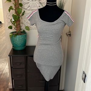 grey sporty dress. lined with navy blue and red stripes on white fabric.